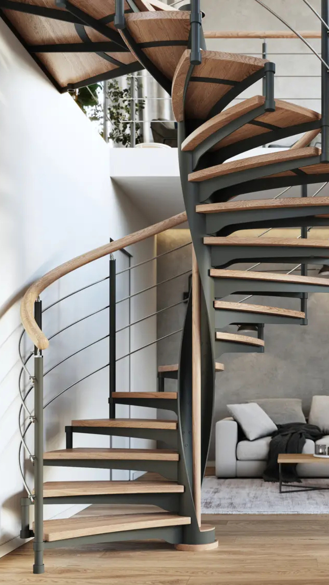 Escalier colimaçon bois et métal avec rampe à fils de fer dans un decor interieur